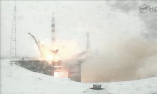 The Soyuz rocket carrying NASA astronaut Dan Burbank and Russian cosmonauts Anton Shkaplerov and Anatoly Ivanishin blasts off from the Baiknour Cosmodrome on Nov. 13, 2011.