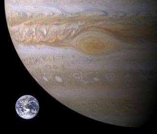 The size of Earth compared to the gas giant Jupiter. The autogenic process is unlikely to start on a watery planet like Earth, but the high levels of methane and ammonia of Jupiter could produce the needed hydrogen cyanide polymers.