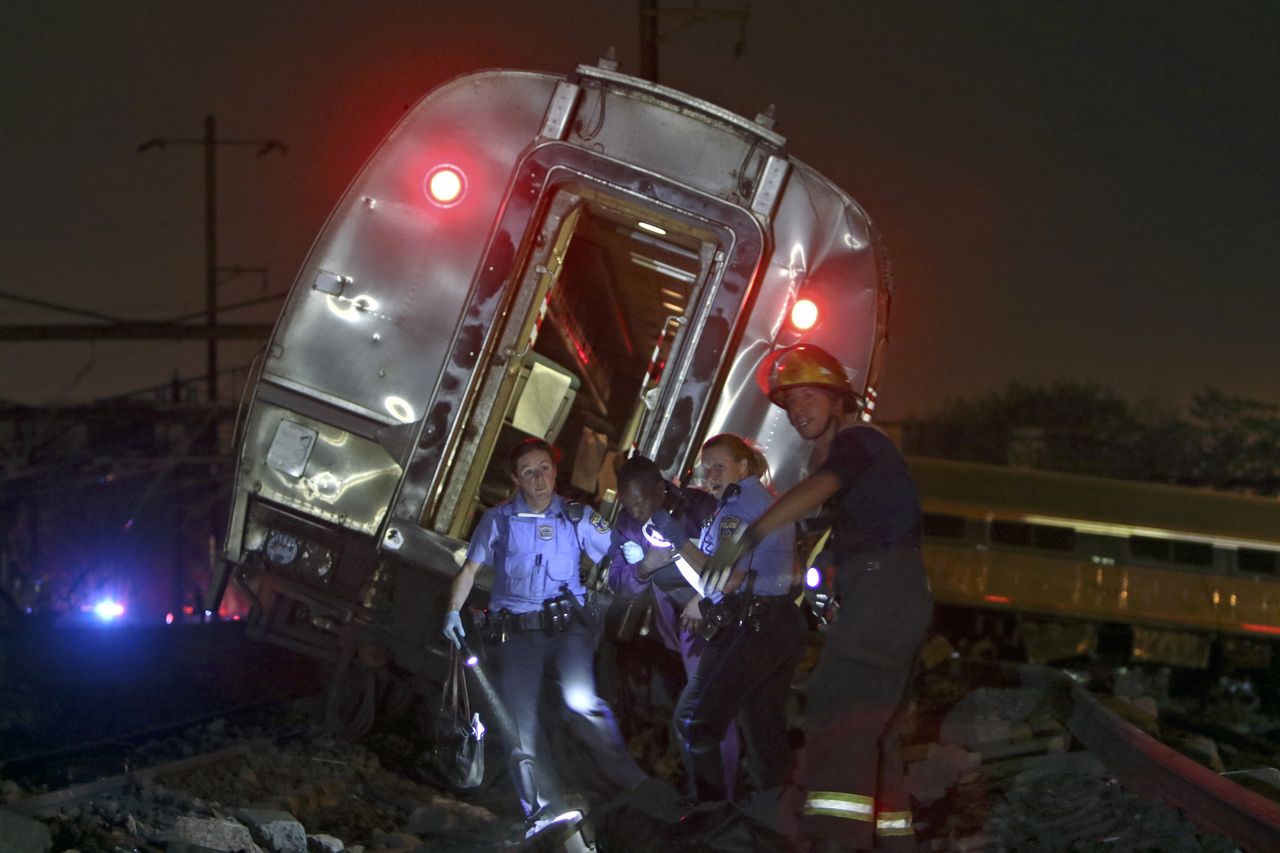 Emergency workers help a victim of the wreck.