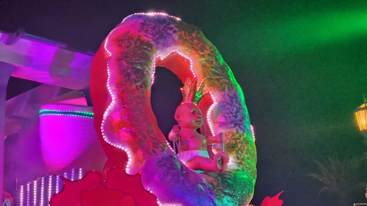 Universal Mardi Gras parade King cake baby float