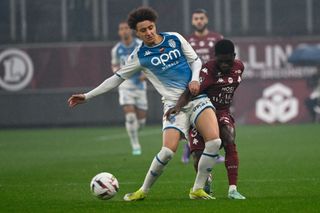 Eliesse Ben Seghir fights for the ball with Metz's Ivorian defender Koffi Kouao