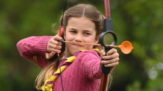 Princess Charlotte of Wales tries her hand at archery