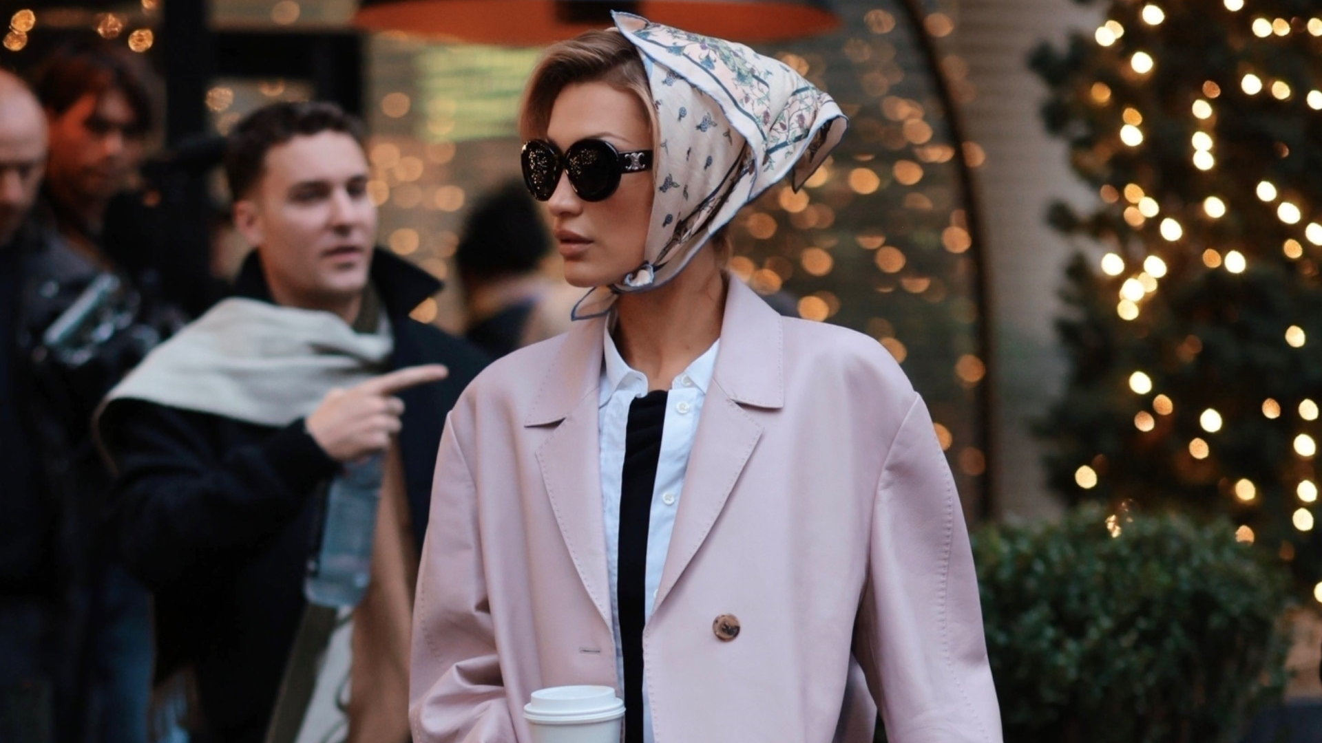 Bella Hadid was spotted in New York wearing a winter take on the capri trend, a pale pink coat, and a silk hair scarf