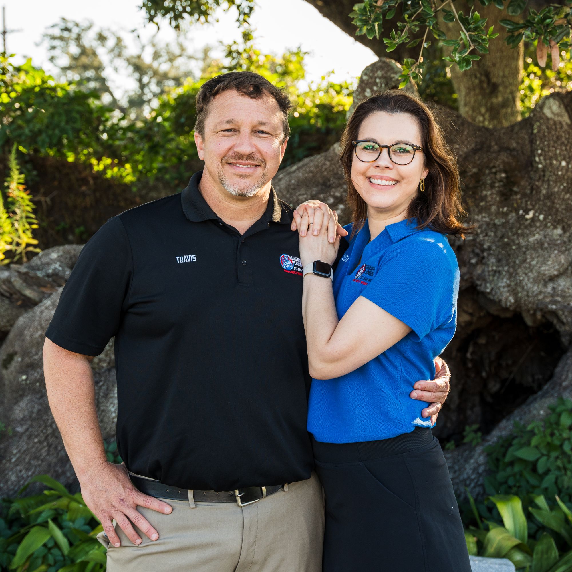 A headshot of Travis Hargrave and his wife