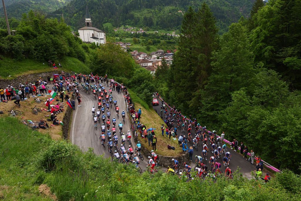 Riders climb the Passo Duron during the 19th stage of the 107th Giro d'Italia cycling race, 157km between Mortegliano and Sappada on May 24, 2024. (Photo by Luca Bettini / AFP)