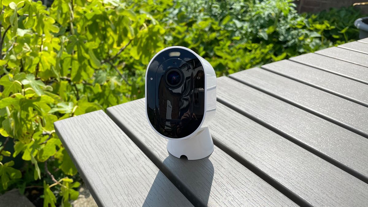 Arlo Pro 4 on its magnetic mount table in the garden