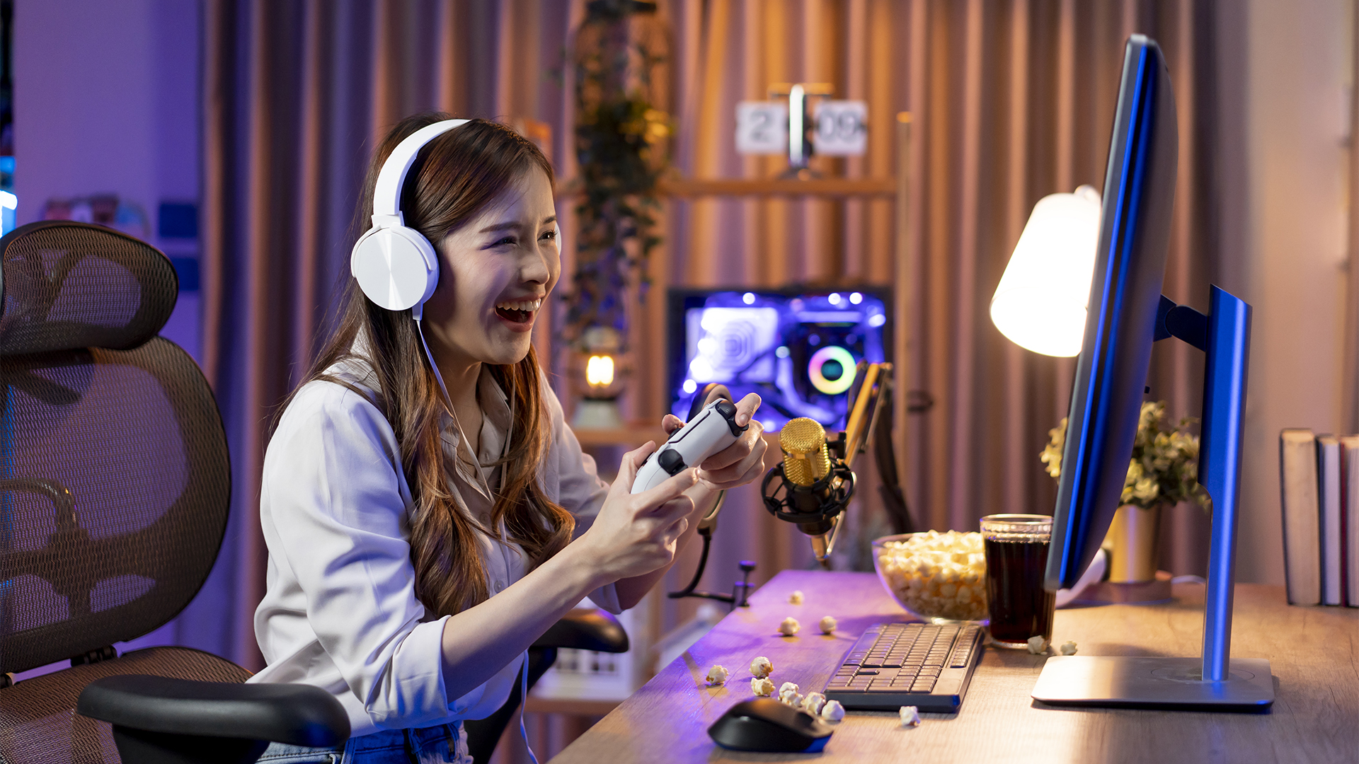 Young woman livestreaming while playing multiplayer online game in living room at home