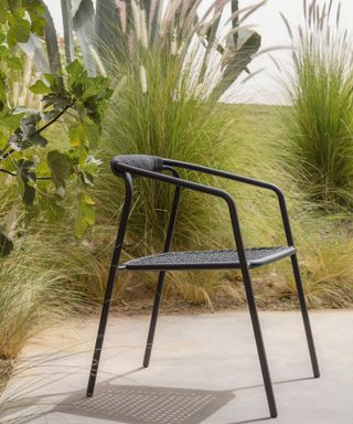 black chair on a concrete patio