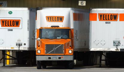 Three large trucks with the Yellow logo
