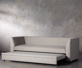 Pavo Trundle Sleeper Sofa against a gray background.