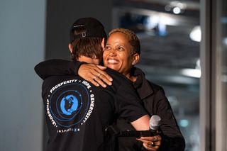 SpaceX Inspiration4 pilot Sian Proctor (right) hugs a SpaceX employee as she receives her astronaut wings on Oct. 1, 2021 at the company's California headquarters.