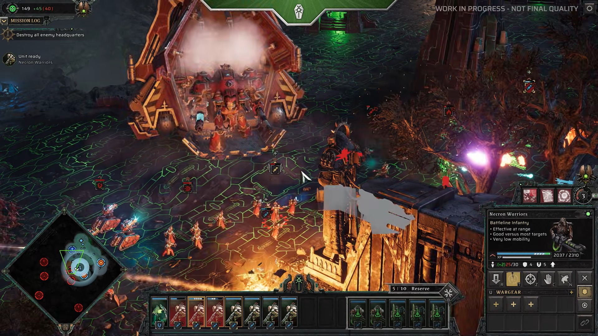 A video game screenshot shows a futuristic battle scene with soldiers and a large, smoke-filled machine. The terrain is glowing green, indicating a sci-fi setting.