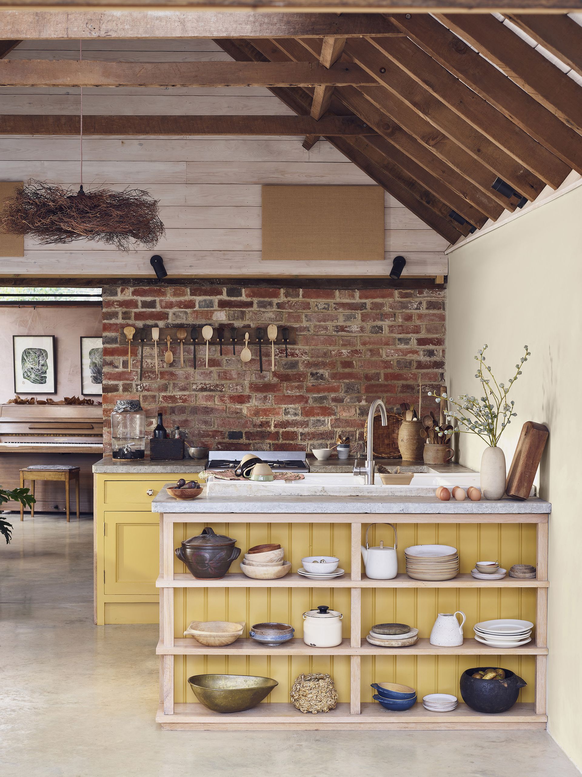 yellow kitchen island with open front with storage Morris & Co