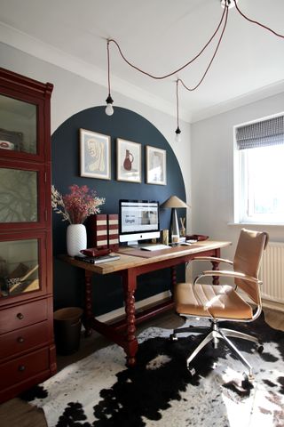 home office with hung ceiling light