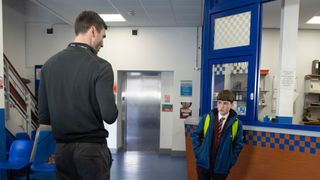 Joseph Brown talks to Kit Green at the police station.