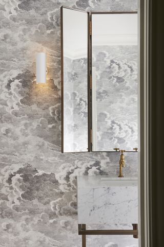 powder room with cloud wallpaper