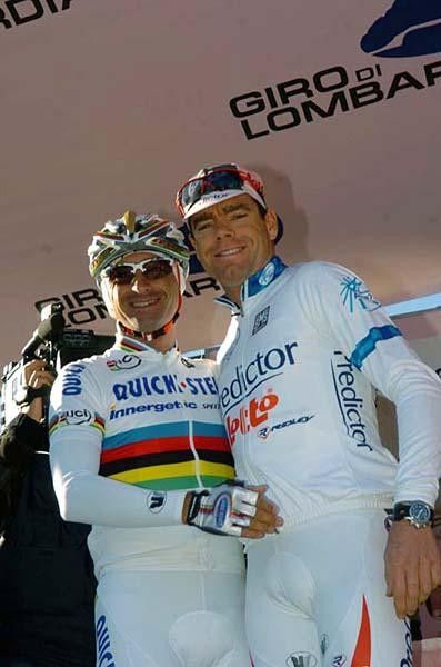 Ah, Bettini can squeeze a smile out of Cadel Evans.
