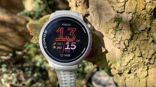 Coros Pace Pro watch hanging on a tree