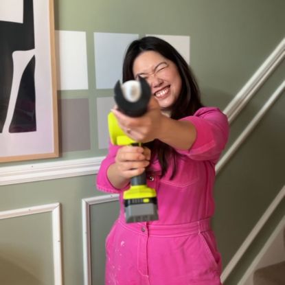 Leah Hodson holding a power tool