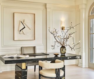 office with paneled walls and black marble desk