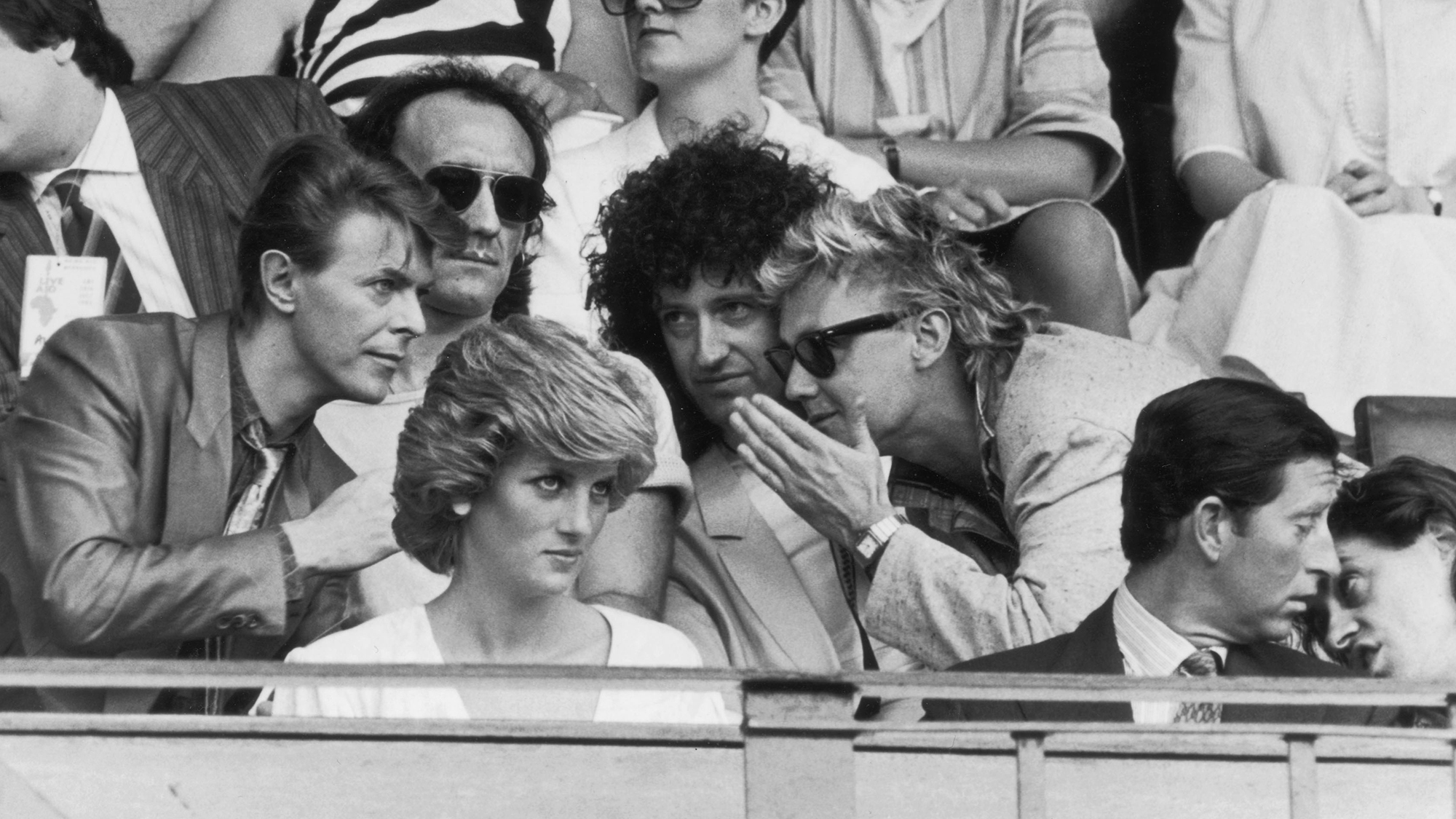 Bob Geldof has a word with Prince Charles, while David Bowie chats with Roger Taylor and Brian May of Queen, during the Live Aid Concert at Wembley Stadium, 13th July 1985.