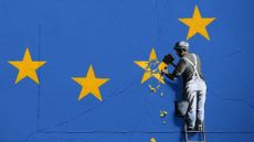 A Banksy image showing a star being chipped off the EU flag