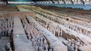 A shot of rows of Qin Terracotta Warriors in the Museum of Qin Terracotta Warriors and Horses, China