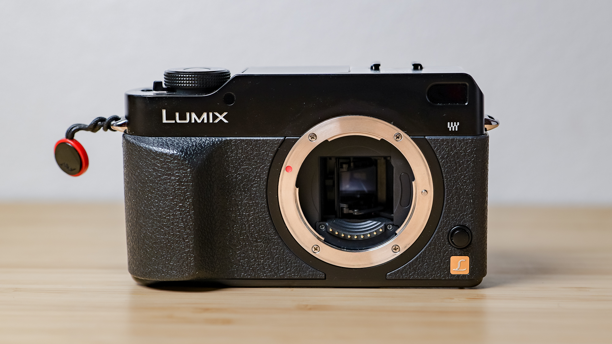 A photo of the Lumix L1 DSLR on a wooden surface