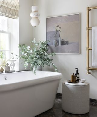 white bathroom with large art on wall