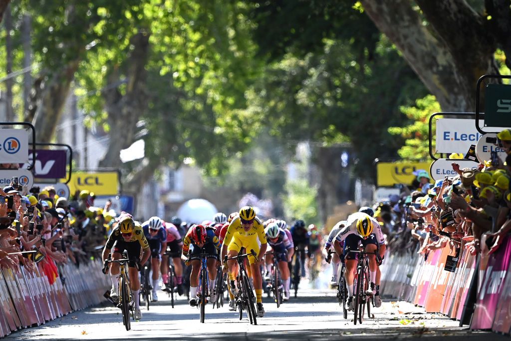 Tour de France Femmes 2023: Marianne Vos (Jumbo-Visma), Lotte Kopecky (SD Worx) in yellow and winning teammate Lorena Wiebes lined across the road in the stage 3 sprint