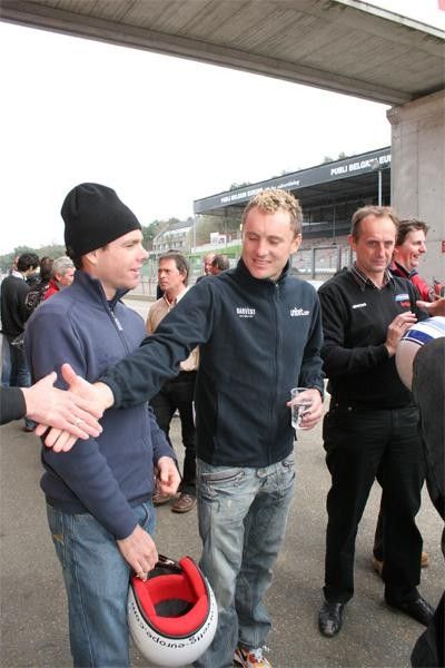 Baden Cooke is greeted by a friend at the Zolder racetrack in Belgium