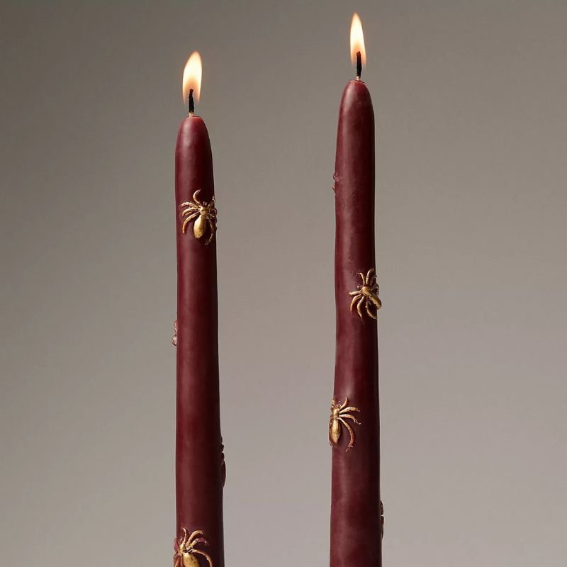 dark red Halloween taper candles with gold spiders