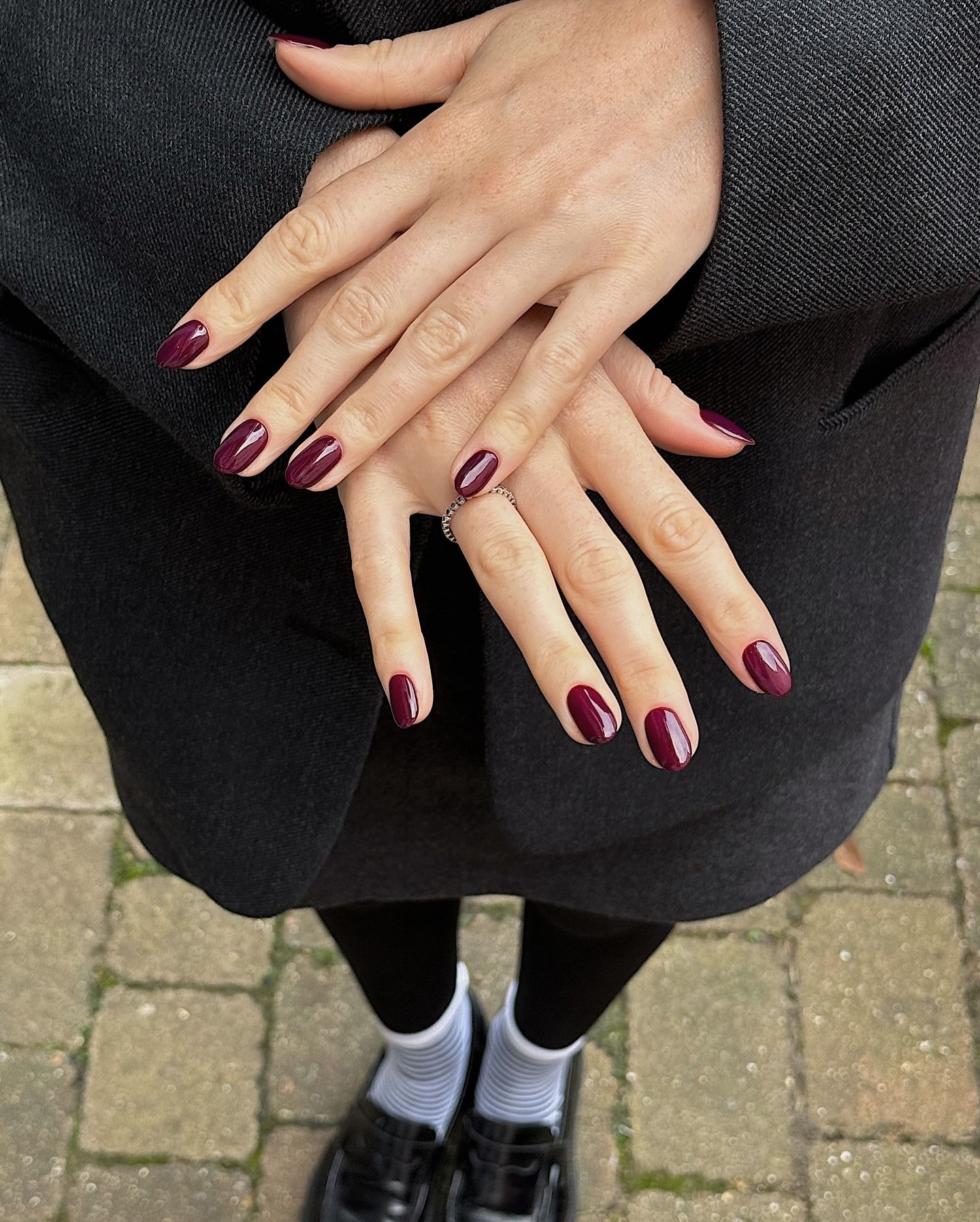 A picture of a deep plum manicure