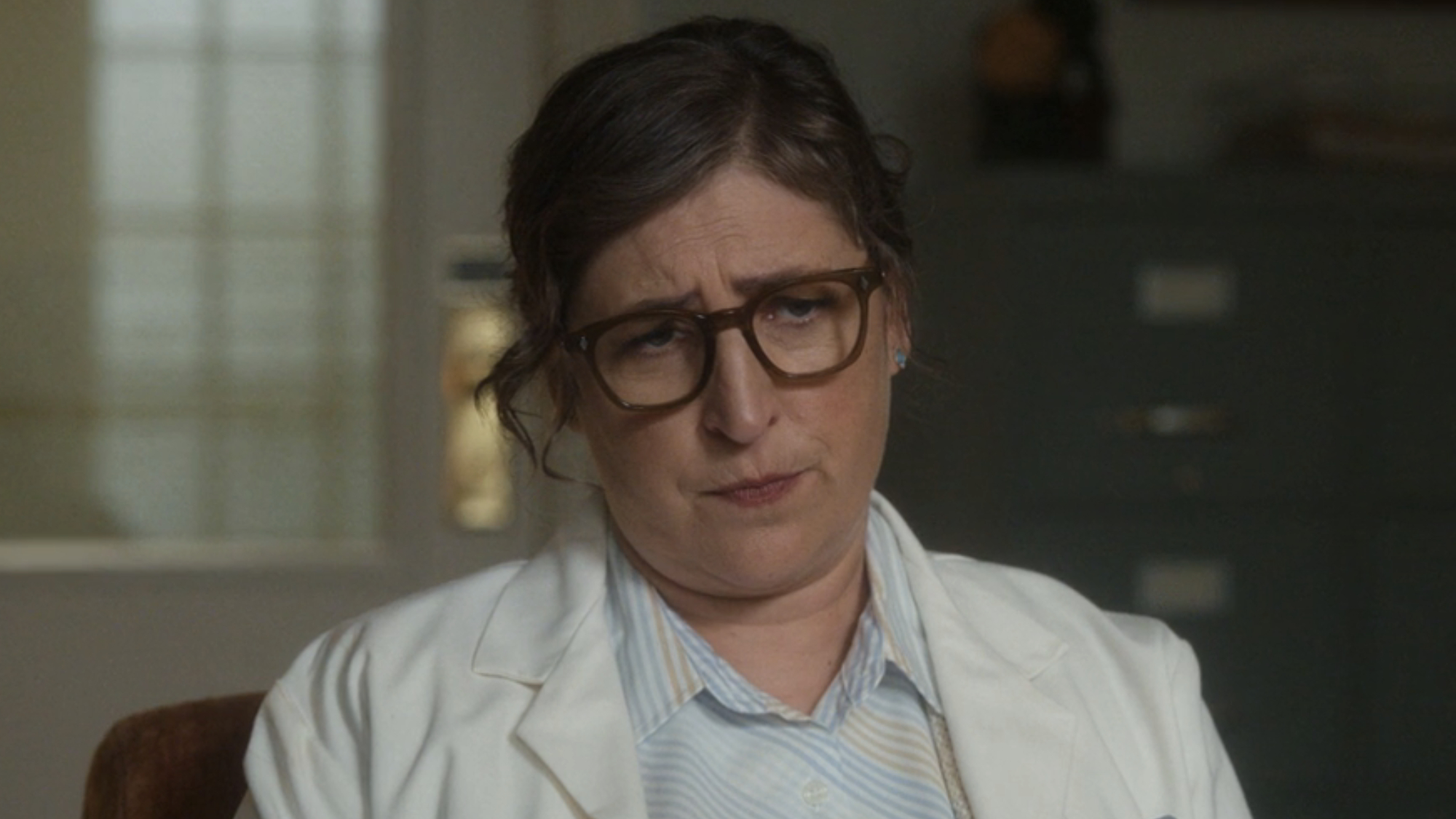 Dr. Amy Farrah Fowler (Mayim Bialik) looks on in shrewd way on Stuart Fails to Save the Universe.