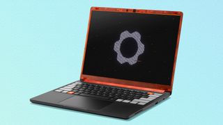 The Framework Laptop 13 Pro with a translucent orange top frame