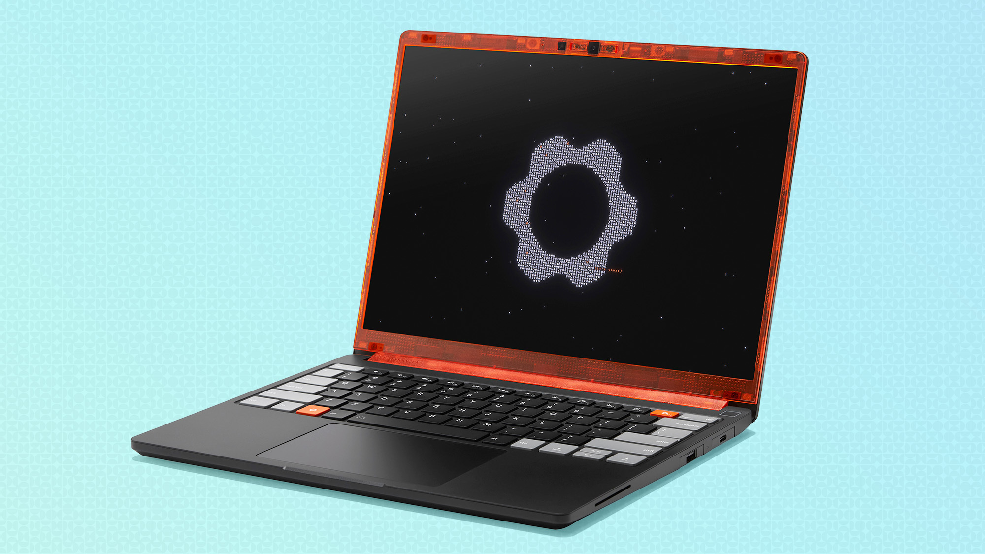 The Framework Laptop 13 Pro with a translucent orange top frame