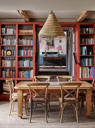 dining-room-with-bookshelves-and-rattan-lighting