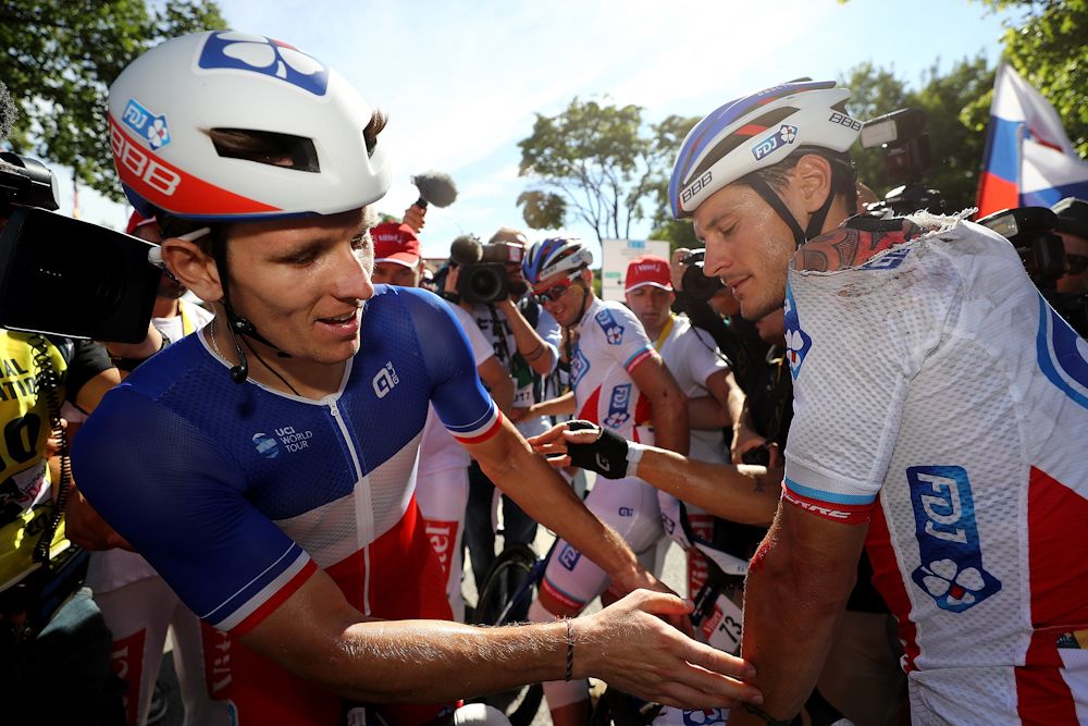 Arnaud Demare (FDJ) checks a teammate battle scars after winning stage 4 of the Tour de France