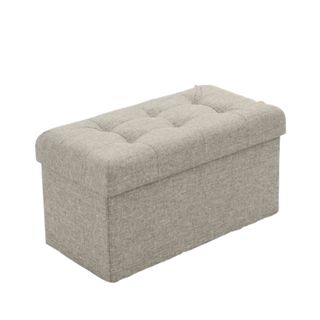 A rectangular beige storage ottoman