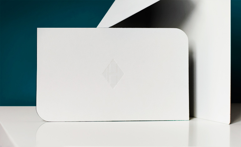 Alternate dye-cut rounded edges, embossed with a distinctly modern H logo