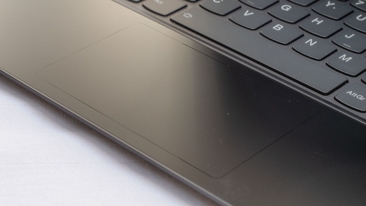 A closeup of the touchpad of the Lenovo Yoga 9i 14in (Shadow Black)