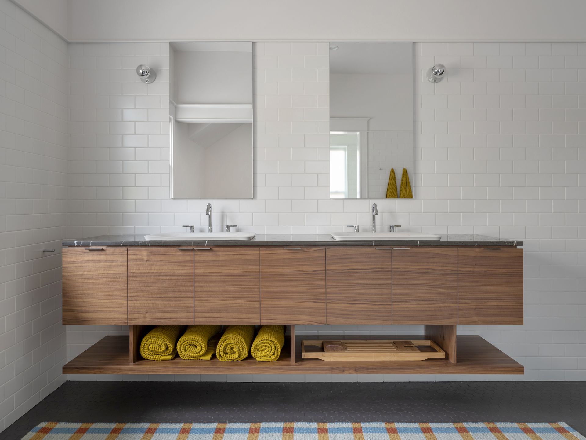 A bathroom with a floating vanity