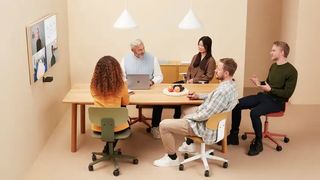 The Huddly S1 videoconferencing camera being used in a small conference setup.