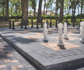 outdoor chess board created from multi colored paving