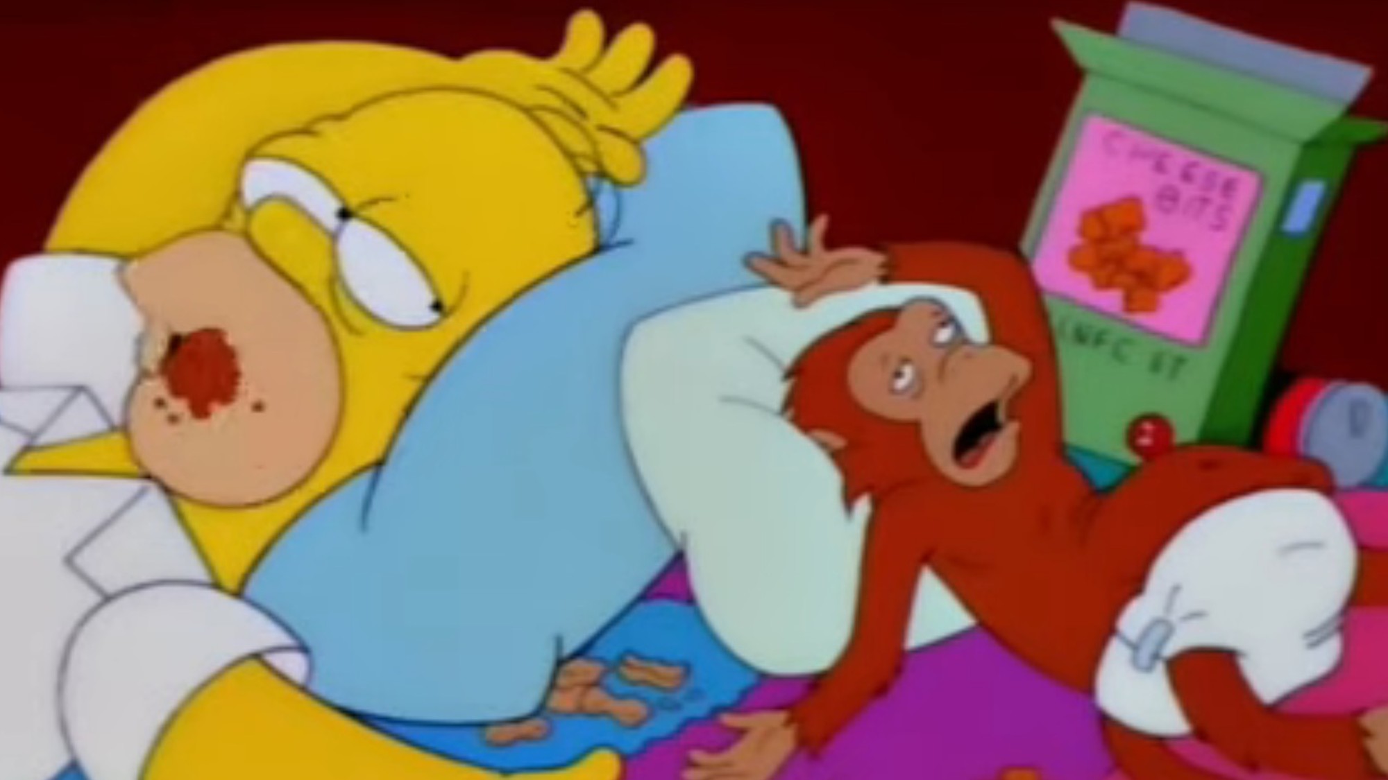 Homer and Mojo passed out on the floor in The Simpsons