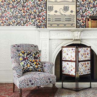 living room with art nouveau patterns wallpaper and armchair