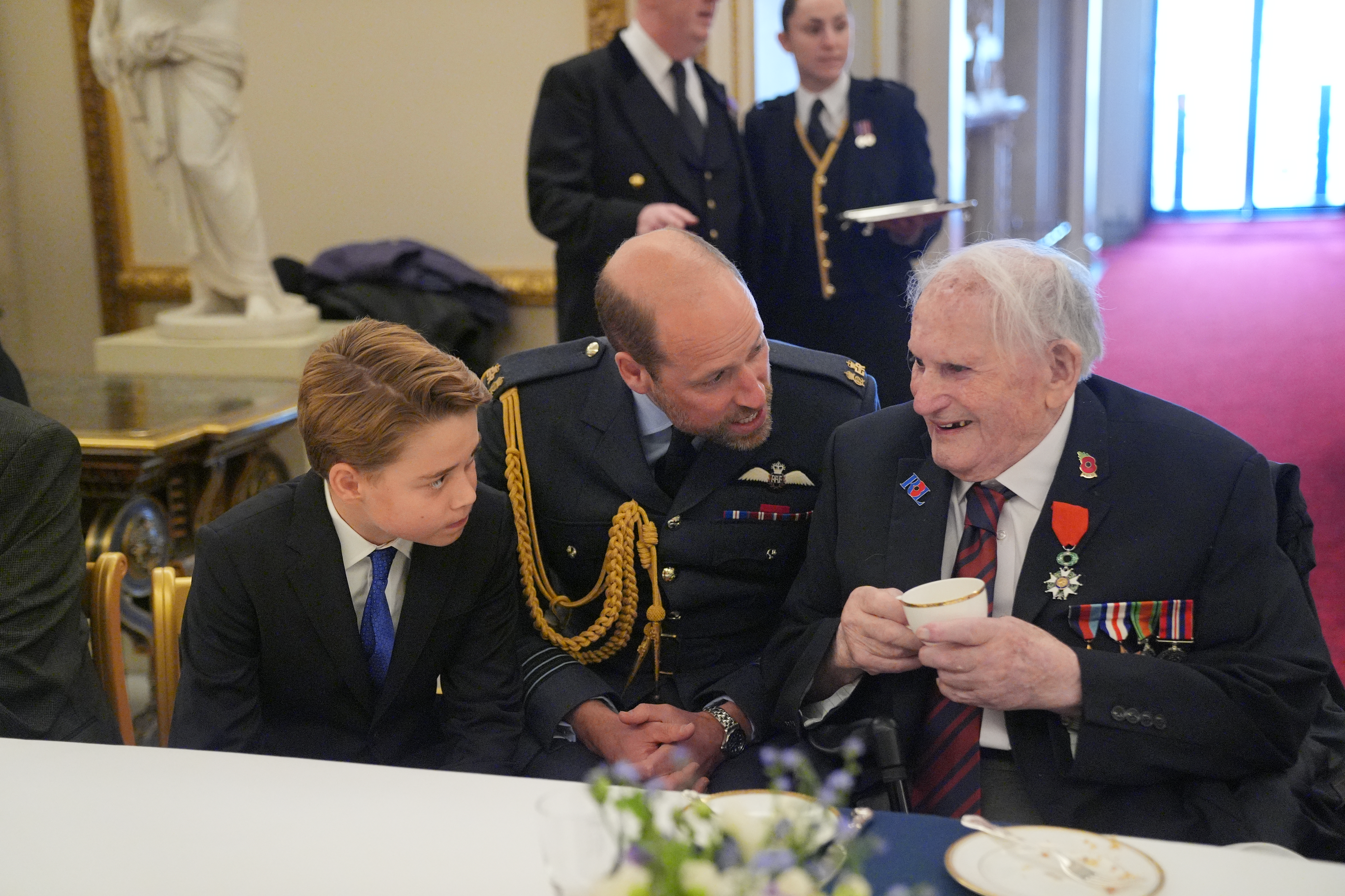 Prince George, Prince William and WWII veteran at tea