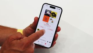 Apple iPhone 14 Pro with music player on screen