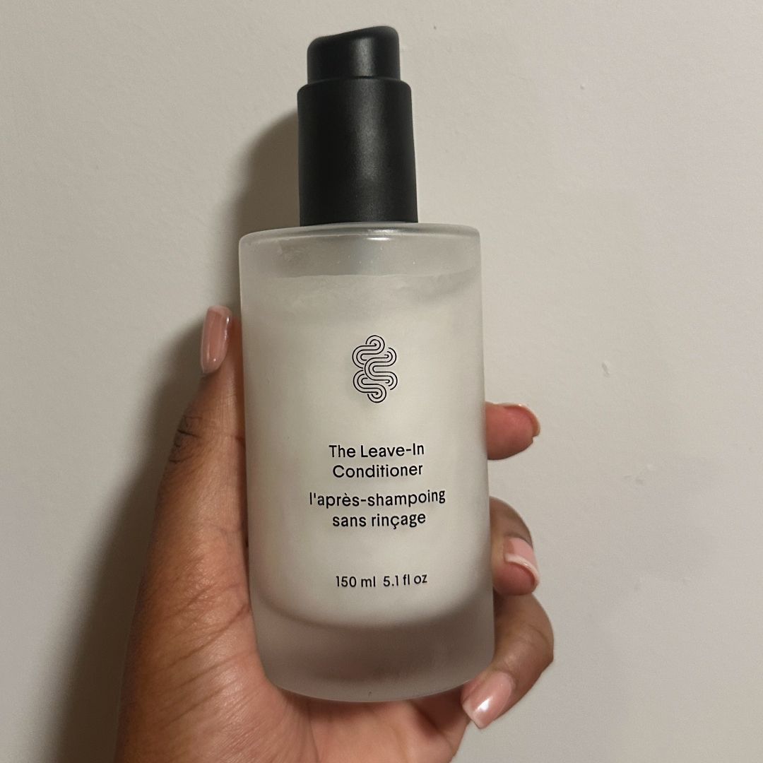 Ariel Baker testing Crown Affair The Leave-In Conditioner Cream.