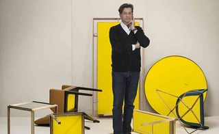 An image of Bruno Moinard and pieces of yellow furniture